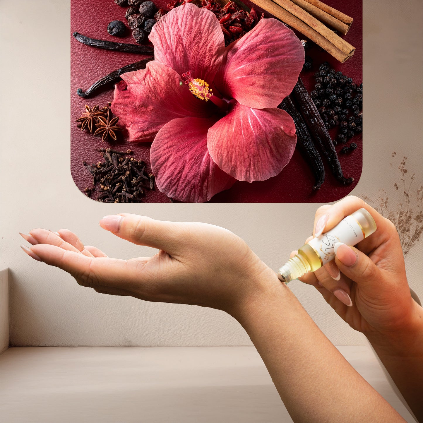 Applying LeScent Delina roll-on perfume oil onto the wrist with a warm neutral setting and a bold hibiscus-themed artistic panel above, inspired by Maison Crivelli Hibiscus Mahajad.