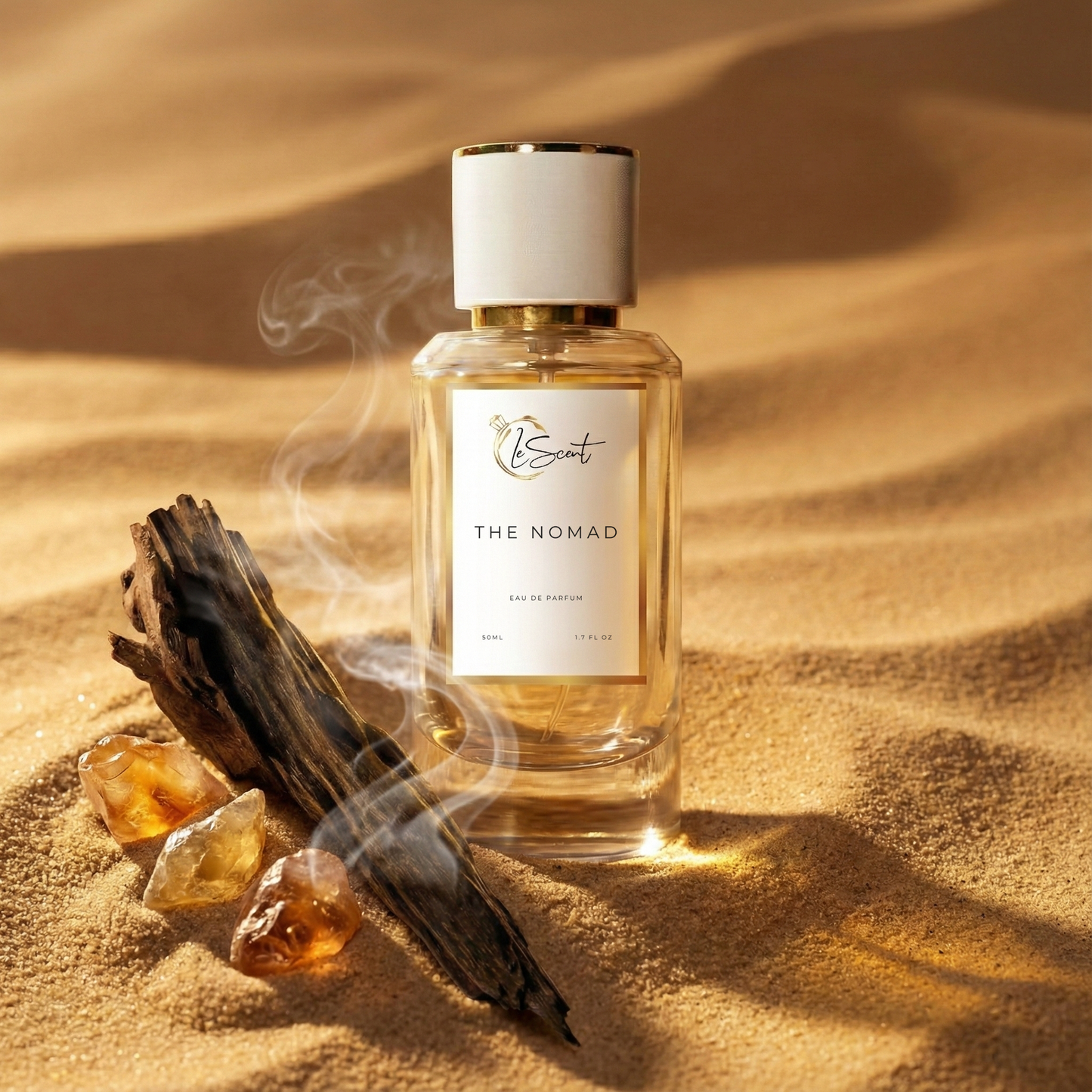 LeScent The Nomad perfume bottle displayed on golden desert sand with burning oud wood, rising smoke, and amber resin stones, premium inspired fragrance influenced by LV Ombre Nomade.