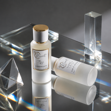 Lescent Frosted Bottle labeled ambroxan and iso e super