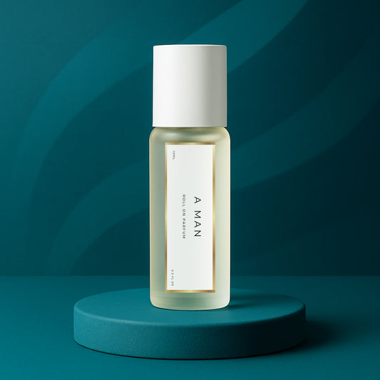 LeScent A Man perfume oil roll-on bottle on a teal pedestal with a dark teal wavy background, inspired by Versace Eros.