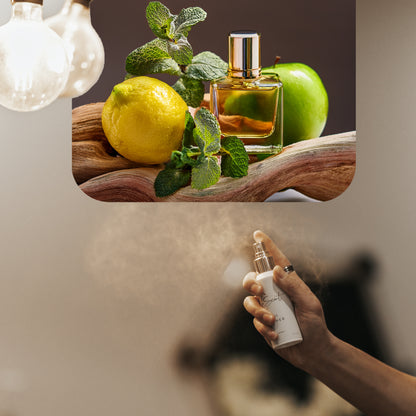 Spraying LeScent A Man home fragrance air freshener, a vibrant fresh scent with mint, lemon, and green apple accords, inspired by Versace Eros.