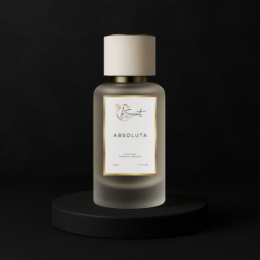 LeScent Absoluta hair fragrance mist bottle on a black pedestal surrounded by pineapple, grapefruit, lemon, and blackcurrant fruits, inspired by Creed Aventus Absolu.
