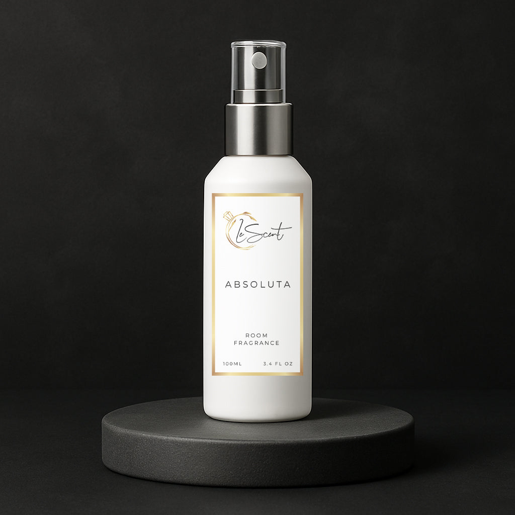 LeScent Absoluta room fragrance spray bottle placed on a black pedestal with clean modern lighting, inspired by Creed Aventus Absolu.