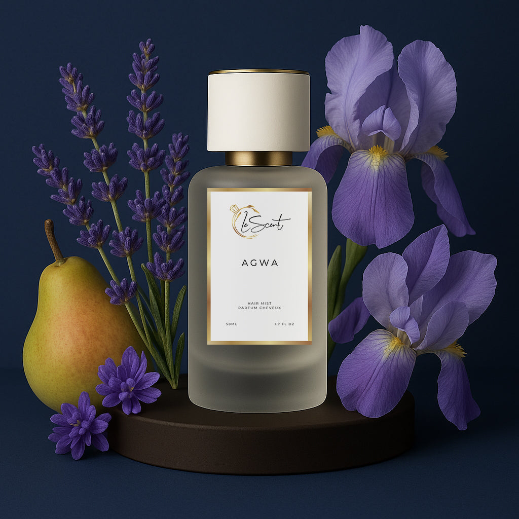 LeScent Agwa hair perfume mist bottle surrounded by lavender flowers, pear fruit, and blue iris petals against a deep blue background, inspired by Armani Acqua Di Gio Profondo.