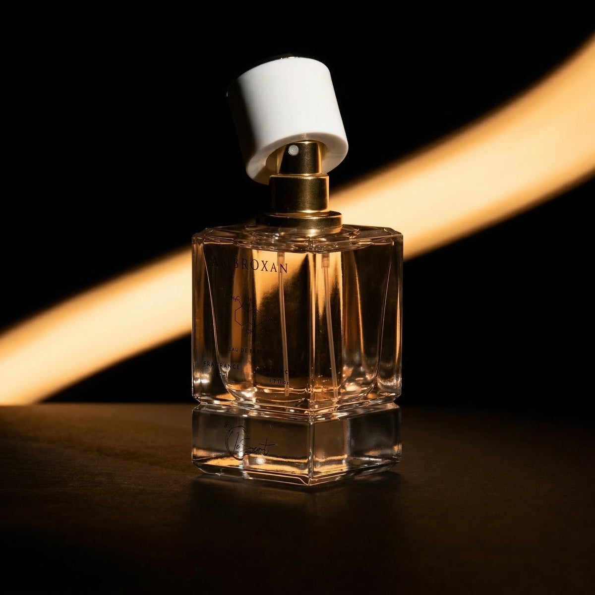 LeScent Ambroxan fragrance enhancer perfume primer spray bottle in moody golden spotlight product photo, long-lasting layering scent, inspired by Ambroxan.
