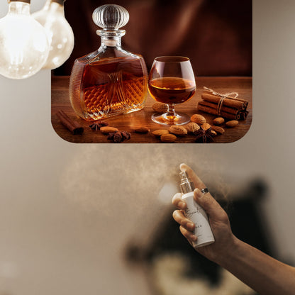 Spraying LeScent Angel Room Spray inspired by Kilian Angel Share — warm blend of cognac, praline and vanilla filling the air with amber sweetness.