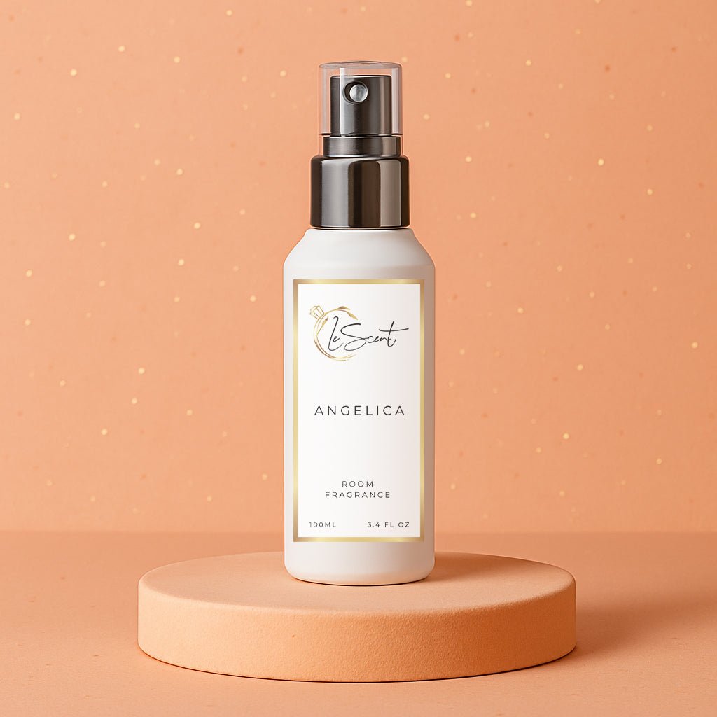 LeScent Angelica room fragrance spray bottle placed on a peach platform against a glowing apricot background with soft studio lighting, inspired by Yves Saint Laurent Supreme Bouquet.