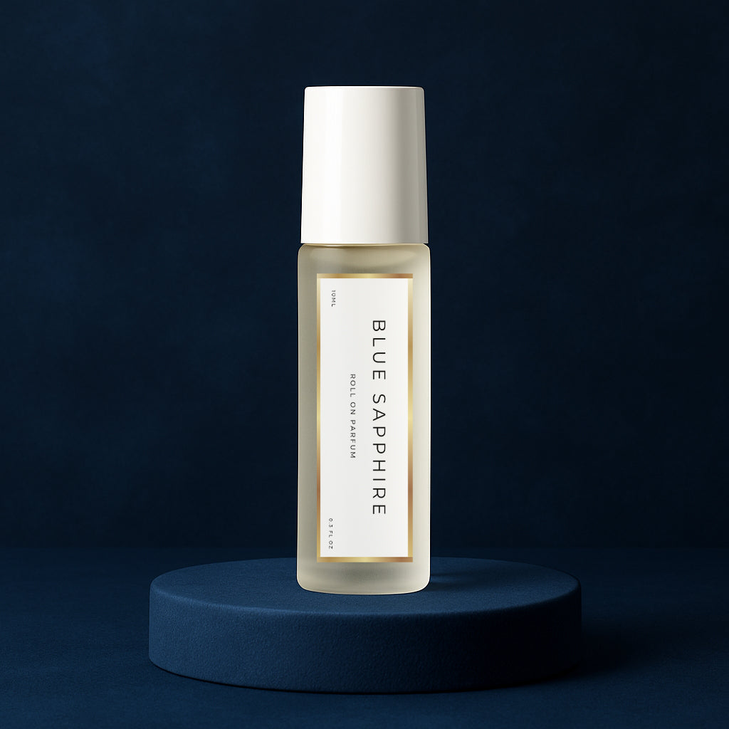 LeScent Blue Sapphire perfume oil roll-on bottle on a dark blue pedestal with a solid dark blue background, inspired by Bleu De Chanel EDP.