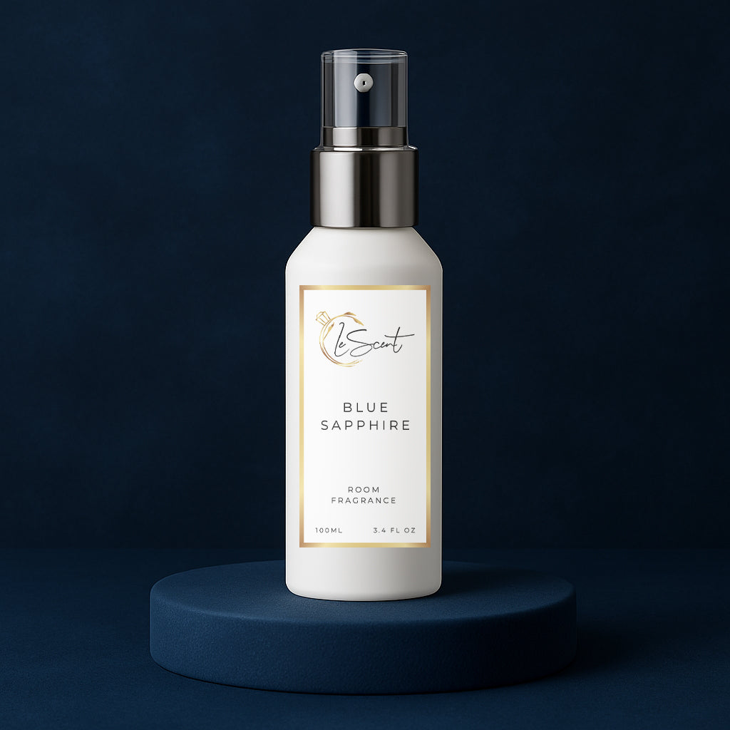 LeScent Blue Sapphire room spray bottle on a dark blue pedestal with a solid dark blue background, inspired by Bleu De Chanel EDP.