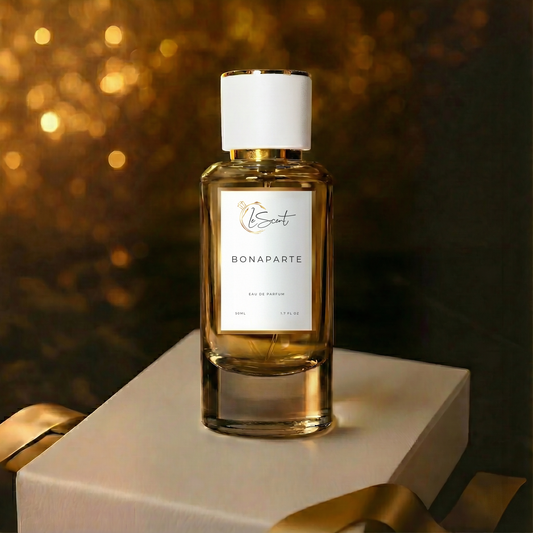 LeScent Bonaparte inspired perfume bottle standing on a white gift box with gold ribbon and warm golden bokeh lighting. Inspired by Creed Aventus.