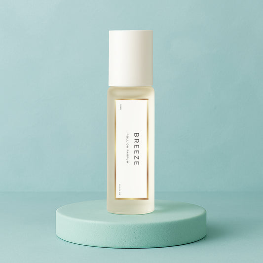 LeScent Breeze roll-on perfume oil bottle on a smooth aqua pedestal with soft teal background and gentle morning light, inspired by Louis Vuitton Imagination.