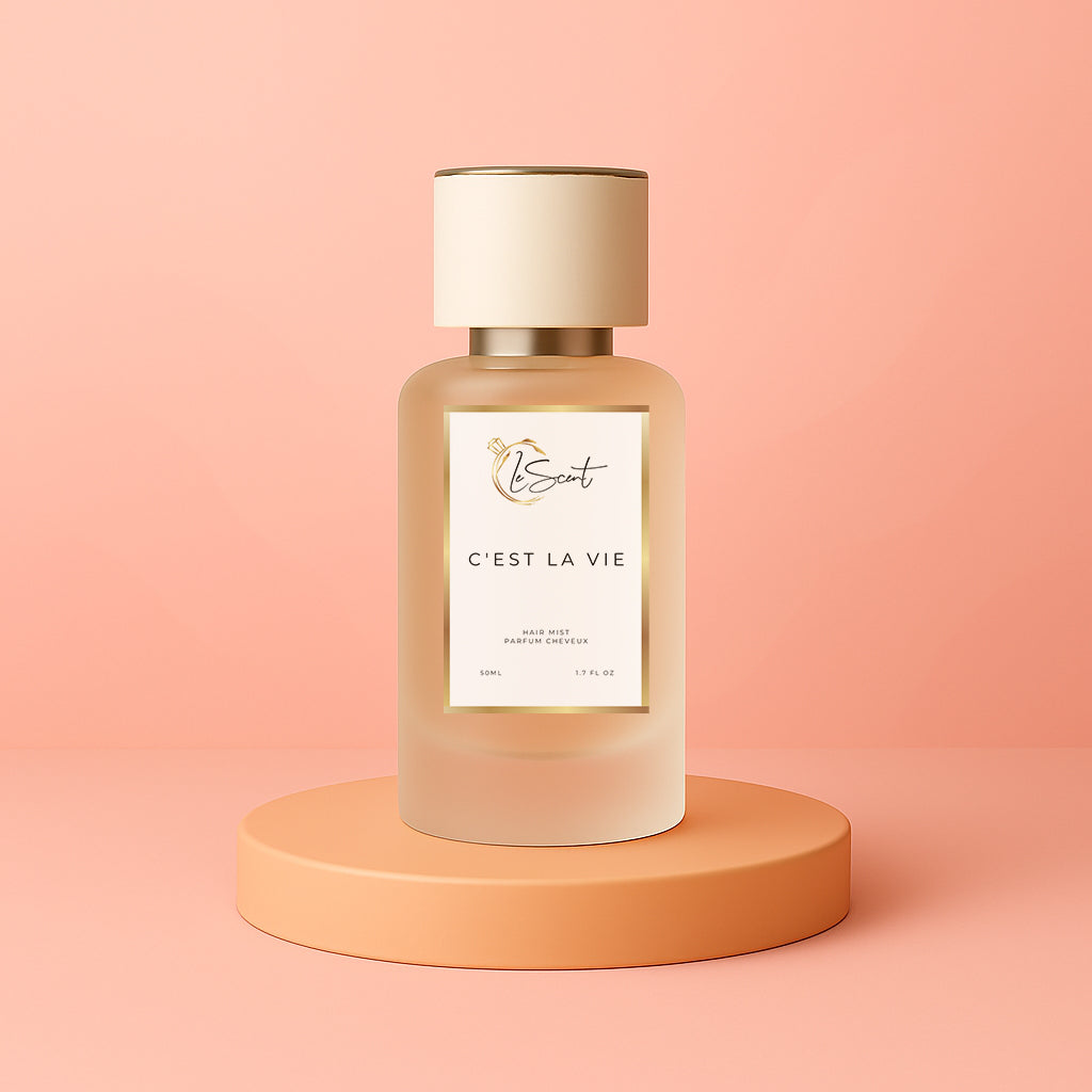 LeScent C’est La Vie hair perfume, hair fragrance and hair perfume mist bottle on a soft coral background, inspired by Lancôme La Vie Est Belle.