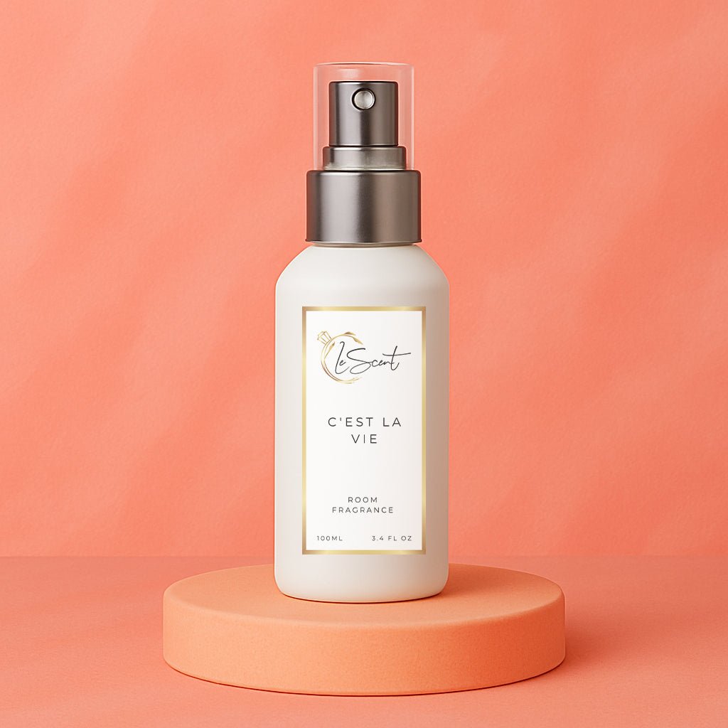 LeScent C’est La Vie room spray, room fragrance and home fragrance freshener bottle on a soft coral background, inspired by Lancôme La Vie Est Belle.