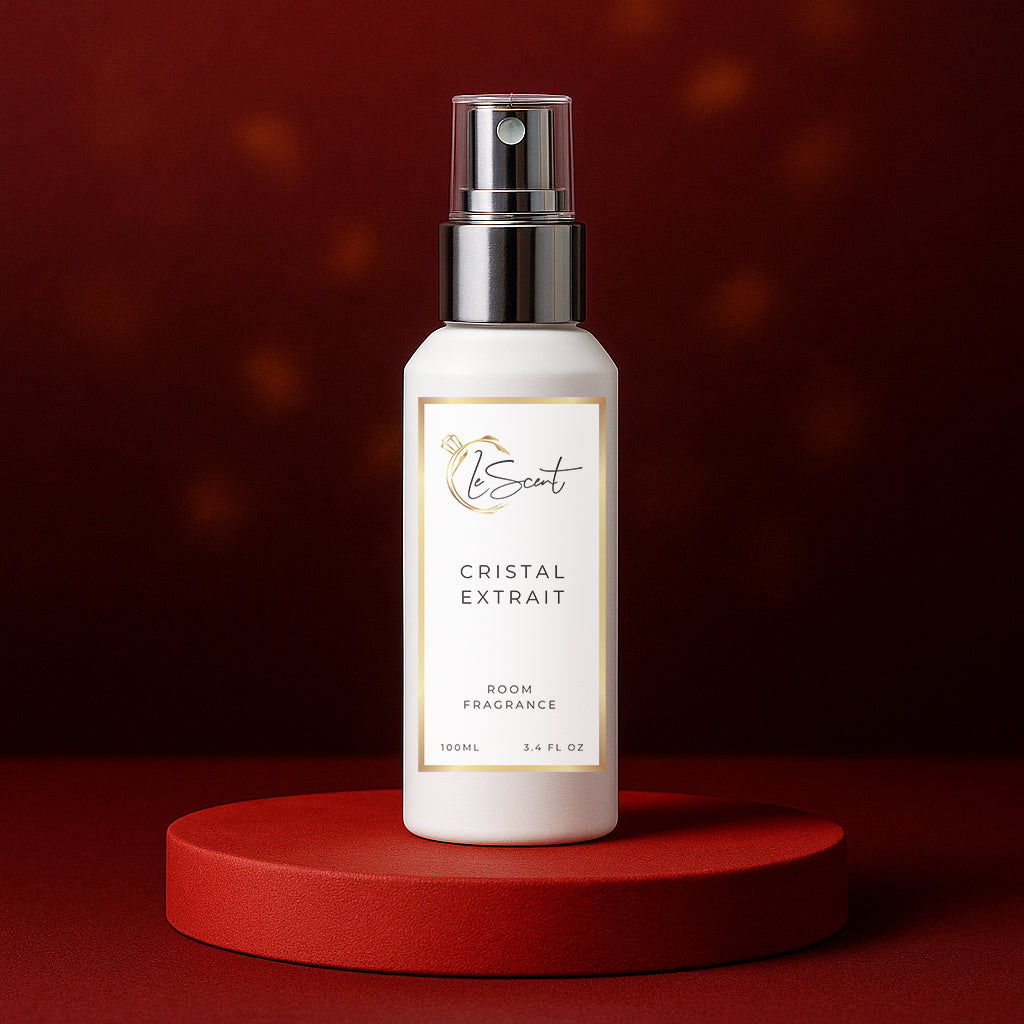 LeScent Cristal Extrait room fragrance spray bottle placed on a red velvet stand against a rich red background with soft lighting, inspired by Maison Francis Kurkdjian Baccarat Rouge 540 Extrait.