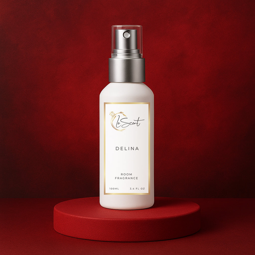LeScent Delina room fragrance spray bottle displayed on a red pedestal with a deep crimson background and elegant soft lighting, inspired by Maison Crivelli Hibiscus Mahajad.