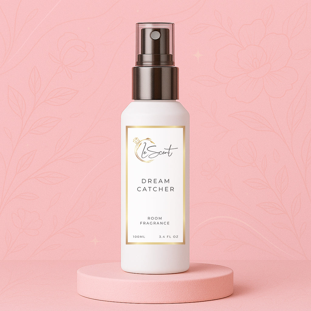 Luxury room spray bottle shown as a room fragrance and home fragrance freshener mist on a pink floral backdrop, inspired by Louis Vuitton Attrape Rêves.