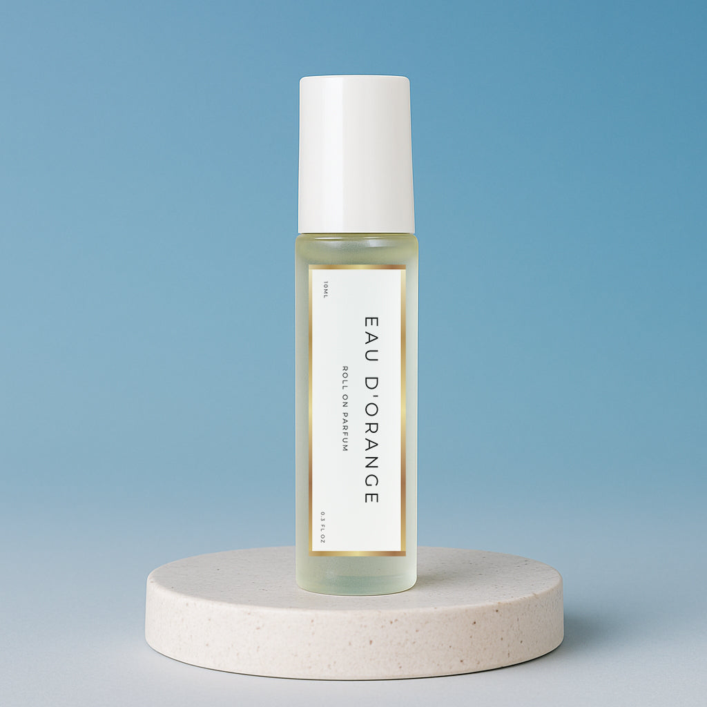 LeScent Eau D’Orange Roll On inspired by Louis Vuitton Afternoon Swim — energizing perfume oil with orange, bergamot, and ginger, offering a bright citrus freshness.