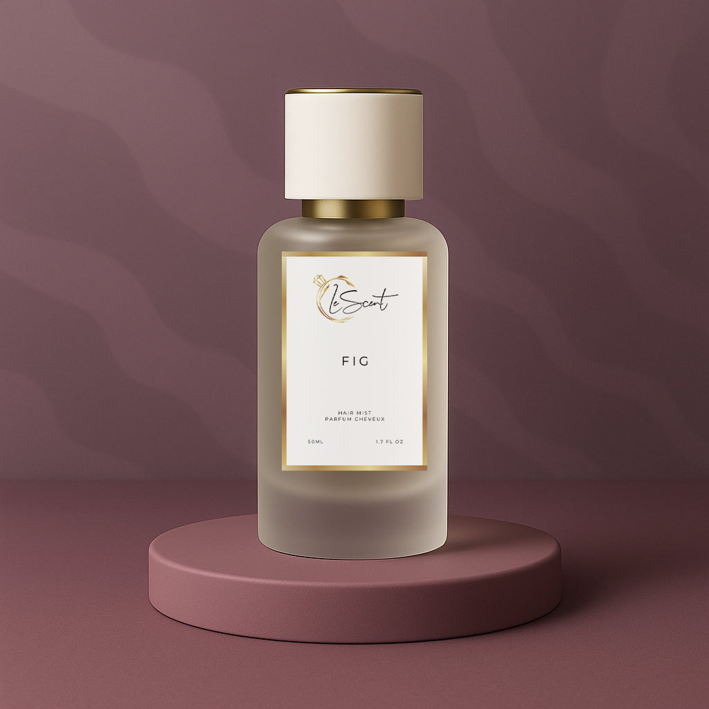 LeScent FIG hair mist inspired by Le Labo Thé Noir 29 showcased on a plum pedestal against a soft plum textured background.