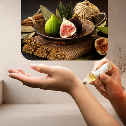 Applying LeScent FIG roll-on perfume oil inspired by Le Labo Thé Noir 29 with fresh fig, bay leaf and woody reed ingredients shown above.