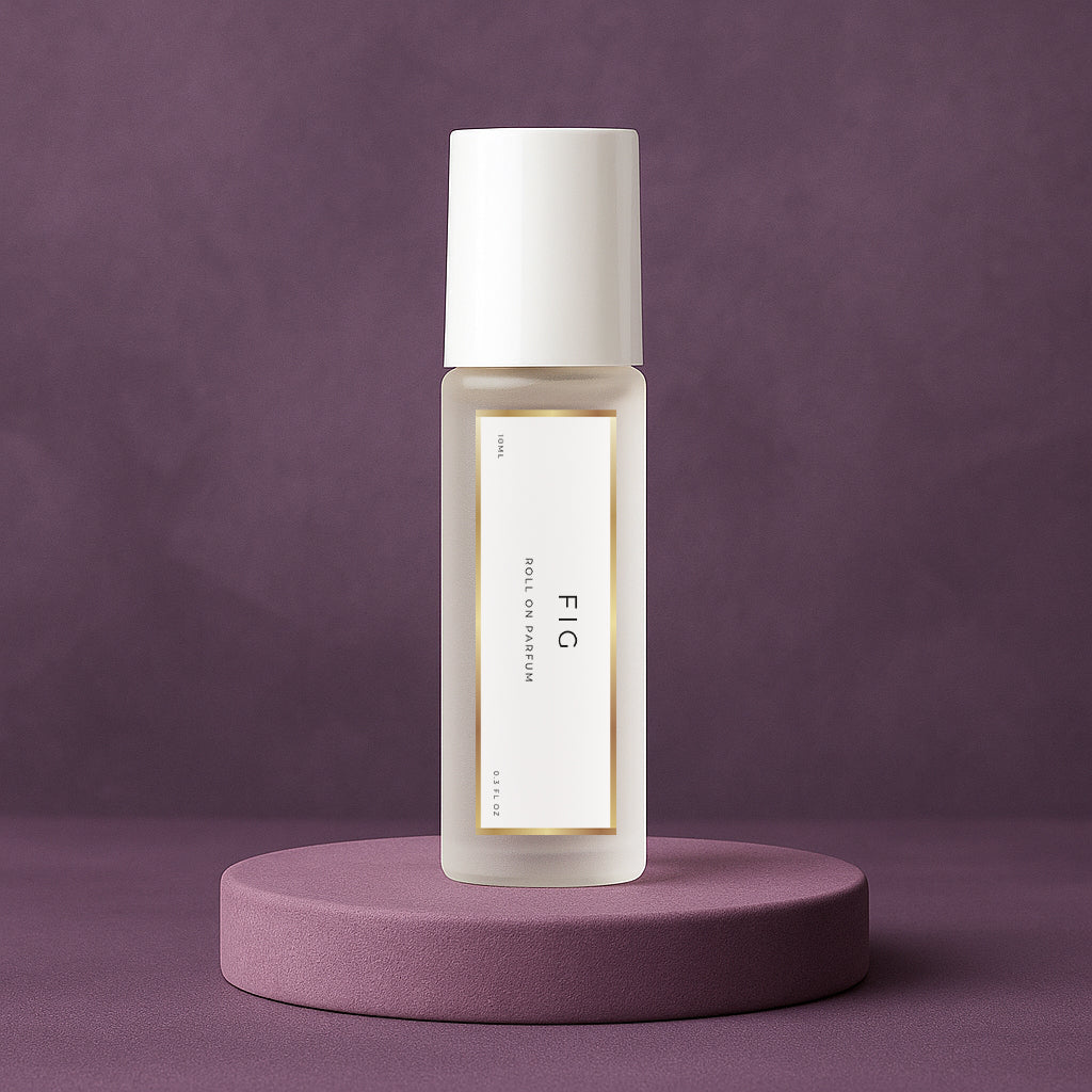 LeScent FIG roll-on perfume oil inspired by Le Labo Thé Noir 29 placed on a soft plum pedestal with a matte plum background.