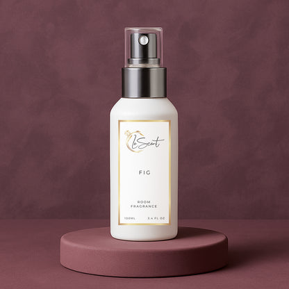 LeScent FIG room spray inspired by Le Labo Thé Noir 29 displayed on a plum pedestal with a smooth matching background.