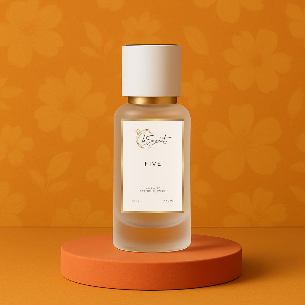 LeScent Five hair mist bottle on an orange pedestal with a floral background, inspired by Chanel No.5.