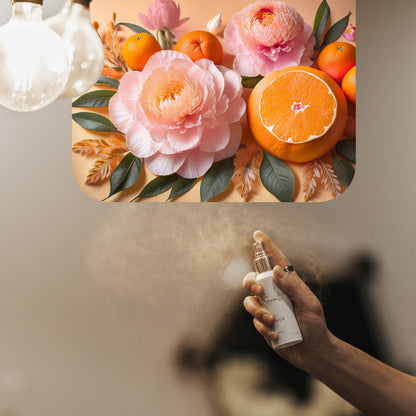 Spraying LeScent Flowers room spray inspired by Gucci Flora — sweet orange and delicate floral home fragrance freshener mist with warm, inviting accords.