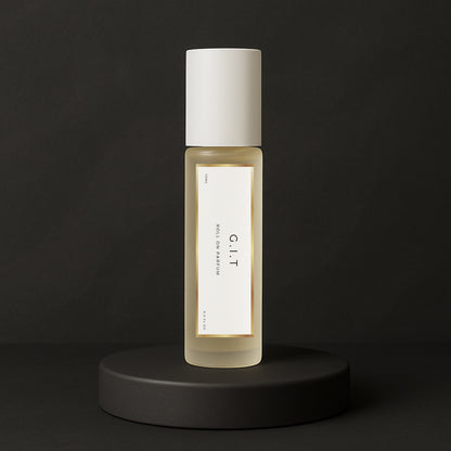 LeScent G.I.T roll-on perfume oil and parfum oil roller bottle on a dark background, premium long lasting perfume oil inspired by Creed Green Irish Tweed.