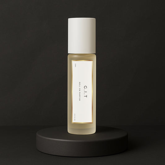 LeScent G.I.T roll-on perfume oil and parfum oil roller bottle on a dark background, premium long lasting perfume oil inspired by Creed Green Irish Tweed.