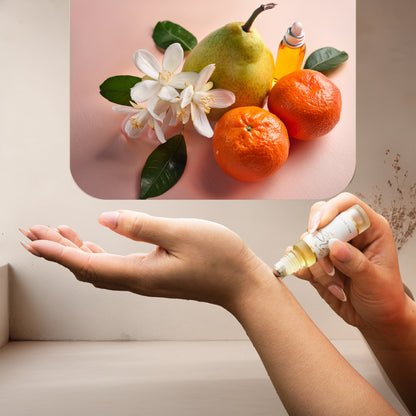 Applying LeScent Girl Next Door perfume oil roll-on inspired by Prada Paradoxe — blend of pear, orange blossom and tangerine creating a smooth floral gourmand scent.