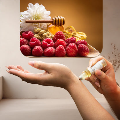 Applying LeScent Her Million perfume oil roll-on inspired by Paco Rabanne Lady Million — sweet raspberry and honey notes blended with white florals for a golden, radiant scent.