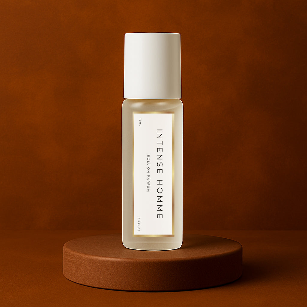 LeScent Intense Homme roll-on perfume oil bottle standing on a warm brown platform with smooth amber background and soft directional lighting, inspired by Dior Homme Intense.