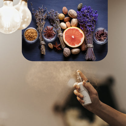 Spraying LeScent JD Elixir home fragrance air freshener, a rich spicy scent with lavender, grapefruit, and nutmeg accords, inspired by Dior Sauvage Elixir.
