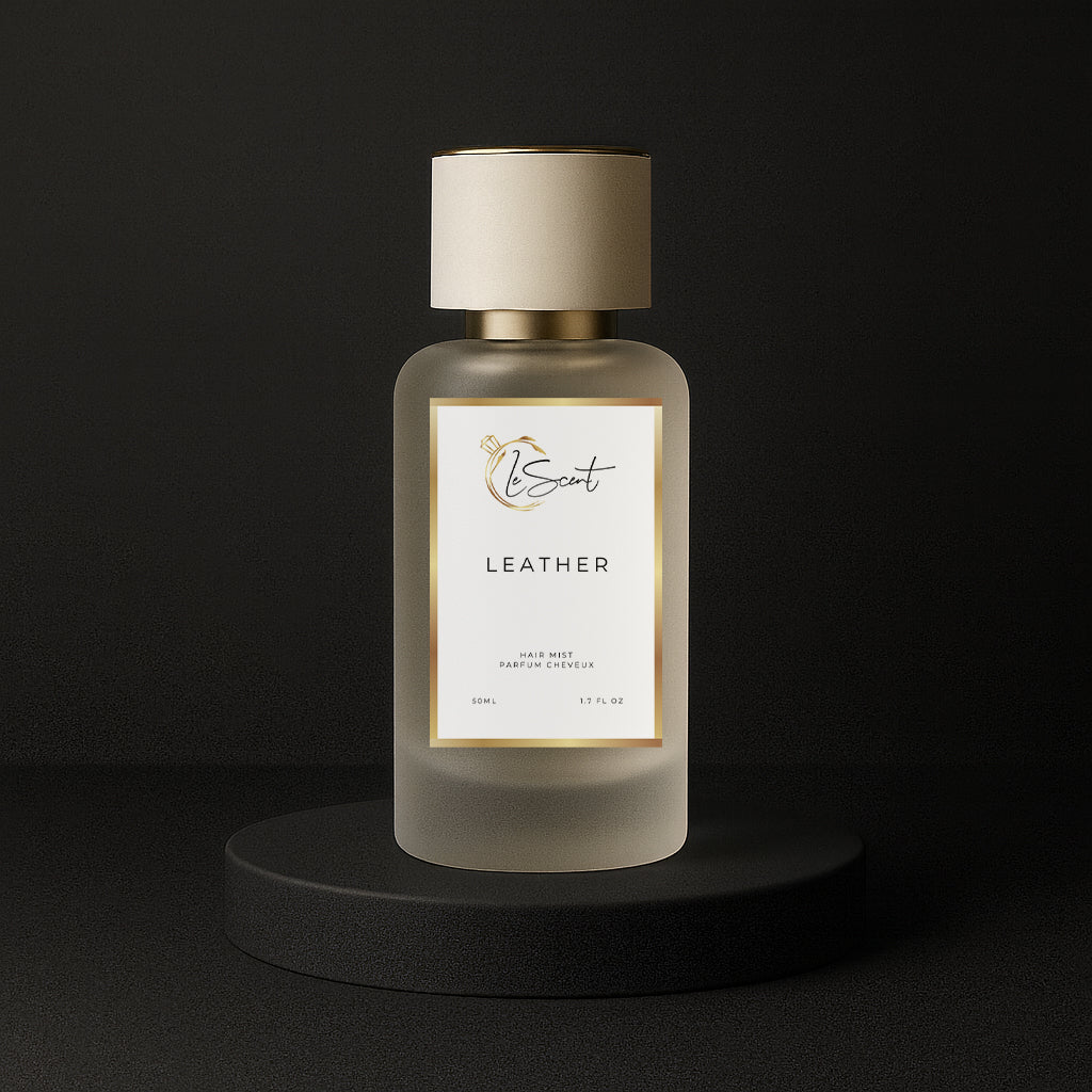 LeScent Leather hair mist bottle on a black pedestal with a solid black background, inspired by Tom Ford Ombre Leather.