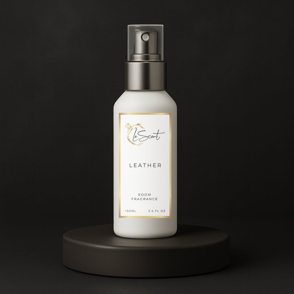 LeScent Leather room spray bottle on a black pedestal with a solid black background, inspired by Tom Ford Ombre Leather.