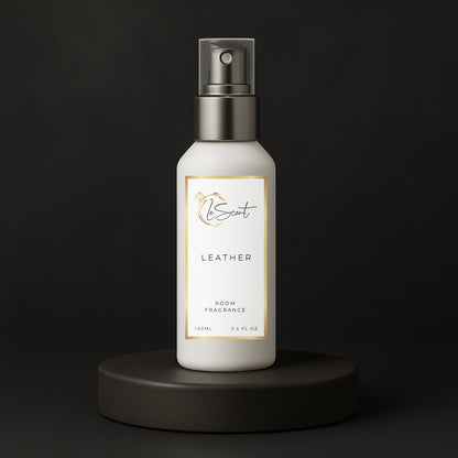 LeScent Leather room spray bottle on a black pedestal with a solid black background, inspired by Tom Ford Ombre Leather.