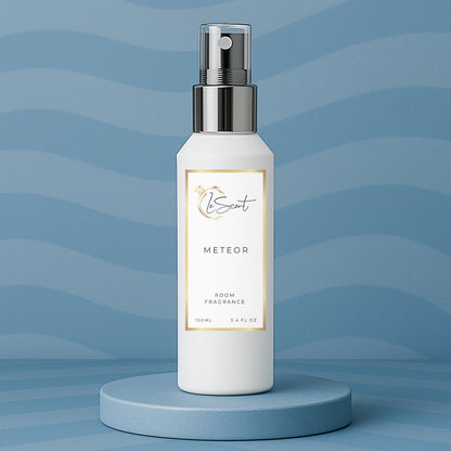 LeScent Meteor room spray, room fragrance, home fragrance freshener mist bottle displayed on a blue platform with a soft wave-pattern blue background, inspired by Louis Vuitton Météore.