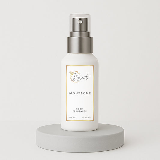LeScent Montagne room spray bottle on a clean grey pedestal with a white background, styled for a modern hero product shot, inspired by Creed Silver Mountain Water.