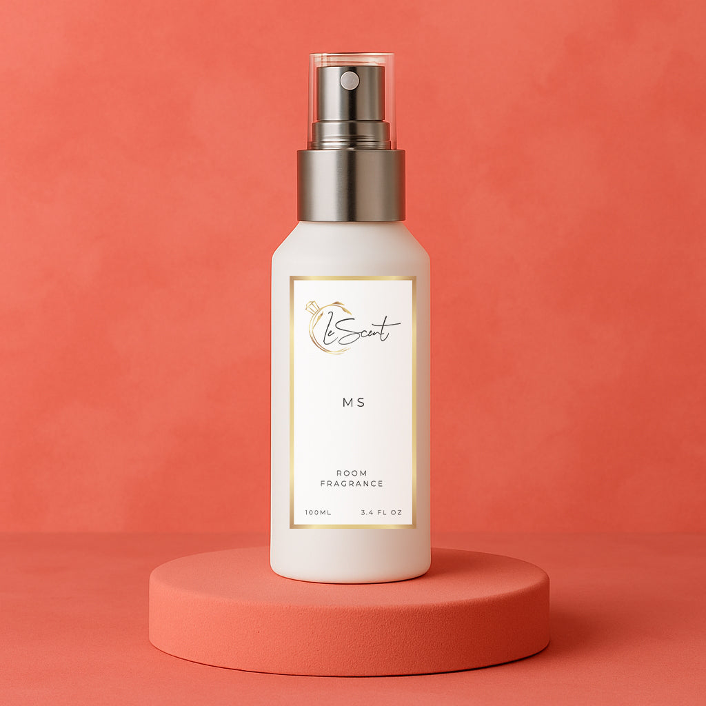 LeScent Ms room spray bottle on a pinkish-red pedestal with a solid pinkish-red background, inspired by Miss Dior.