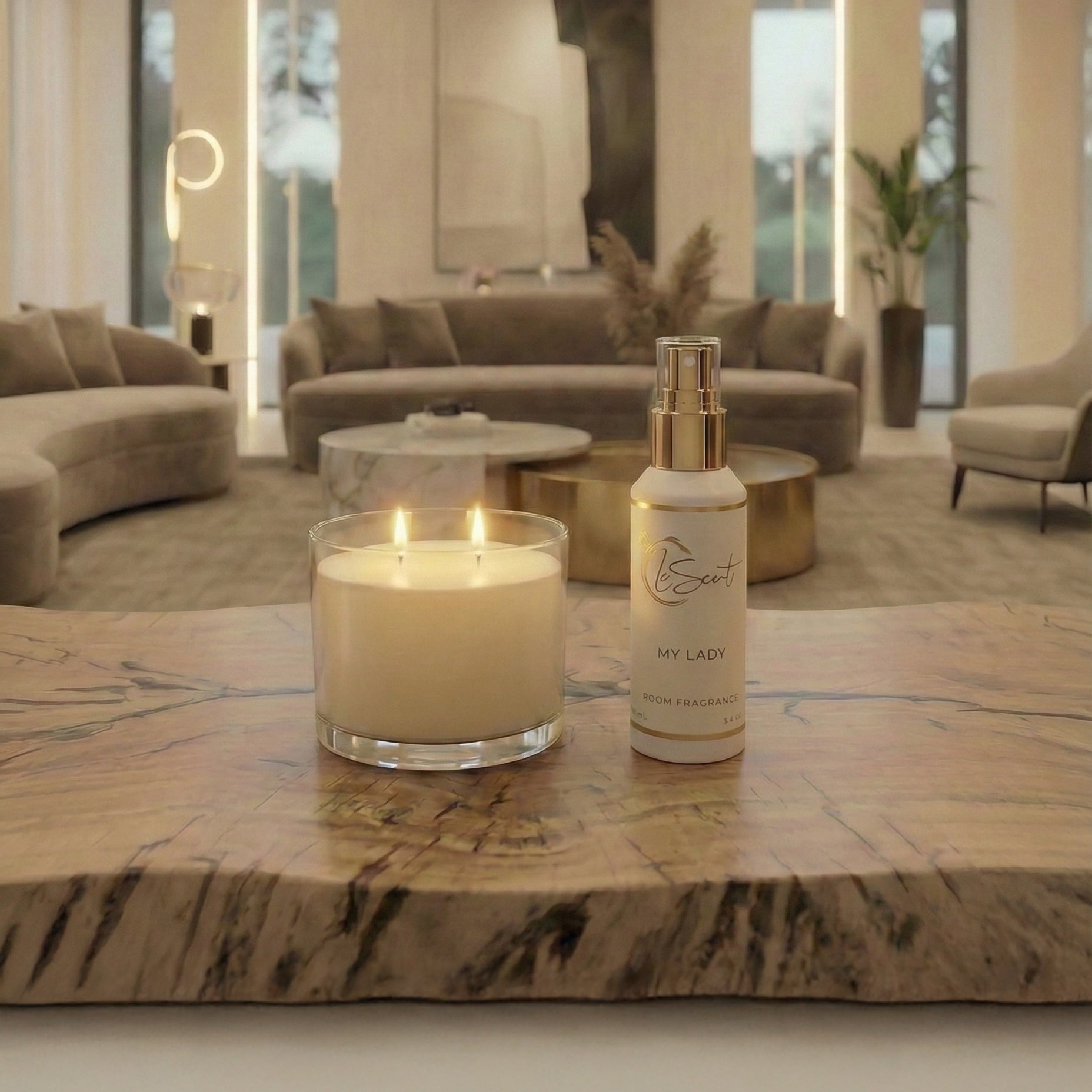 LeScent My Lady room spray bottle on a marble table beside a lit candle in a luxury living room, home fragrance freshener mist lifestyle photo.