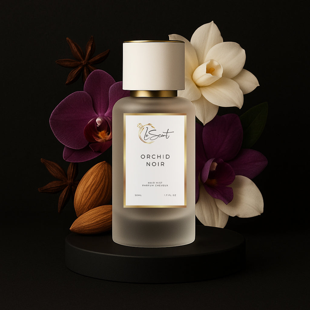 LeScent Orchid Noir hair perfume mist inspired by Tom Ford Black Orchid — orchids, almonds and dark florals arranged behind the bottle.