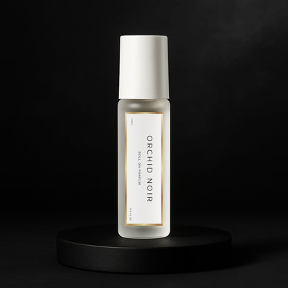 LeScent Orchid Noir perfume oil roll-on inspired by Tom Ford Black Orchid — frosted bottle on matte black pedestal.