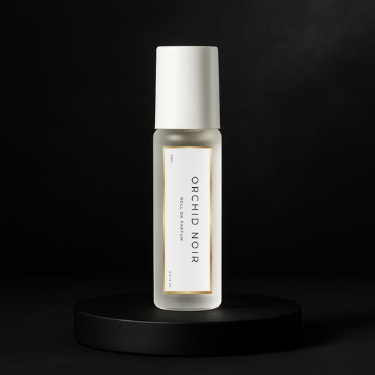 LeScent Orchid Noir perfume oil roll-on inspired by Tom Ford Black Orchid — frosted bottle on matte black pedestal.