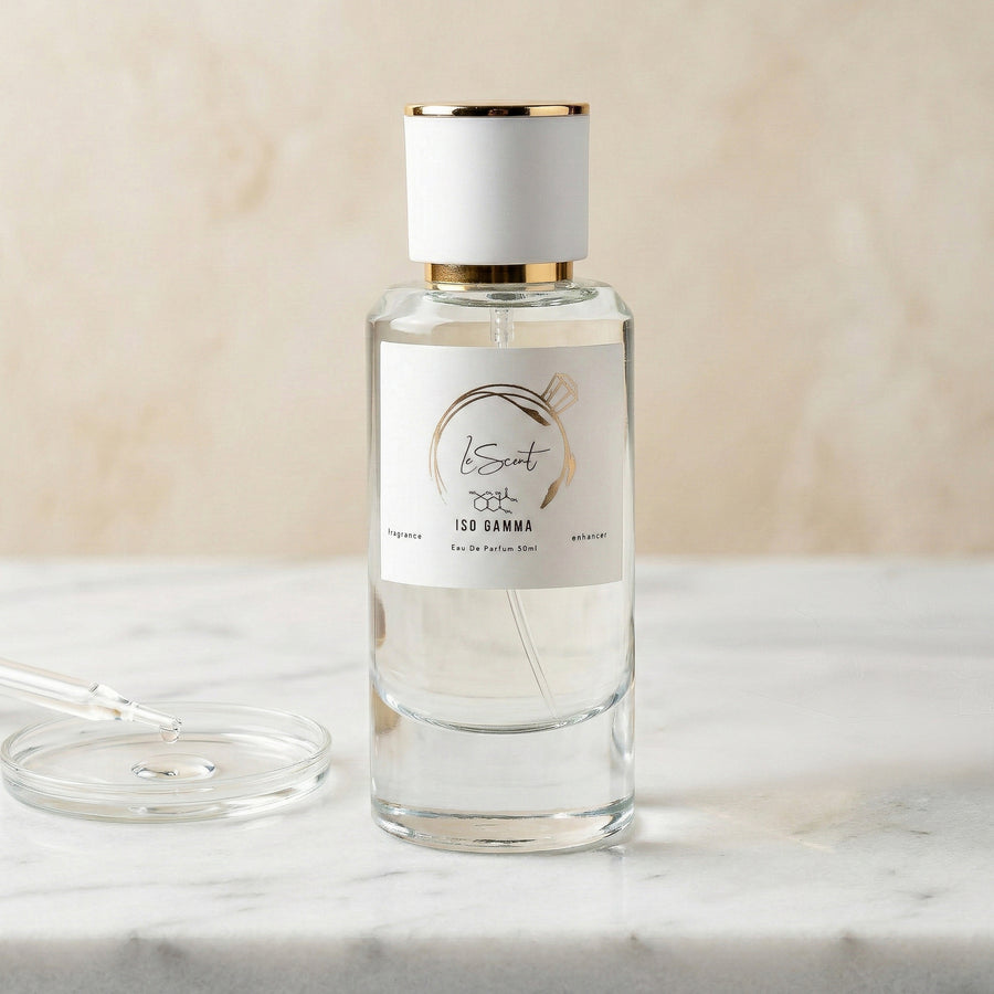 LeScent Iso Gamma perfume primer bottle on a marble surface with a glass pipette in a clean product photo.
