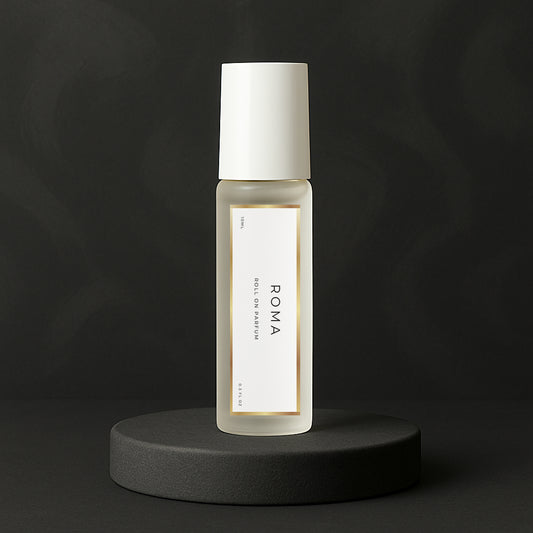 LeScent Roma roll-on perfume oil bottle standing on a matte charcoal platform with soft lighting and dark background, inspired by Valentino Uomo Born In Roma.