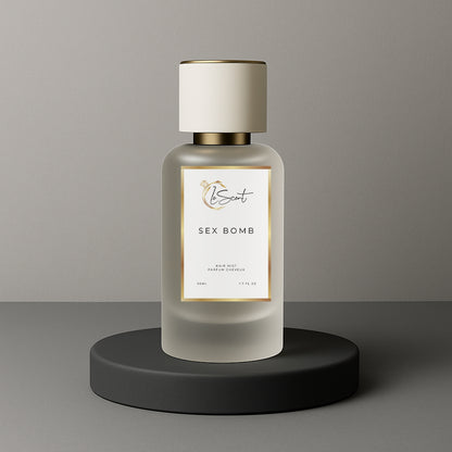 LeScent Sex Bomb hair mist bottle on a black pedestal with a solid grey background, inspired by Viktor & Rolf Spicebomb.