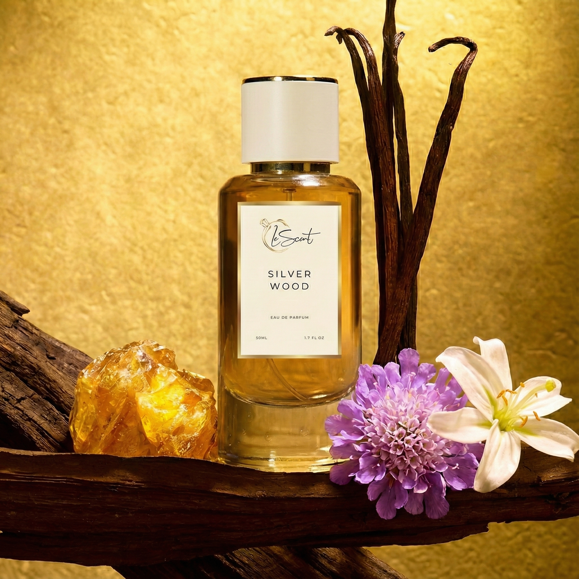 Silver Wood inspired perfume bottle by LeScent with wooden accents, resin, and fresh florals arranged around the bottle on a gold background. Inspired by Dior Bois d’Argent.