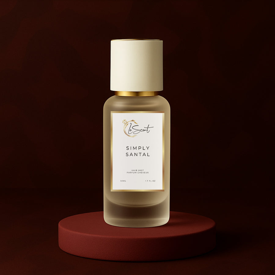 LeScent Simply Santal hair fragrance mist bottle displayed on a burgundy platform with textured leather background and warm amber lighting, inspired by Le Labo Santal 33.