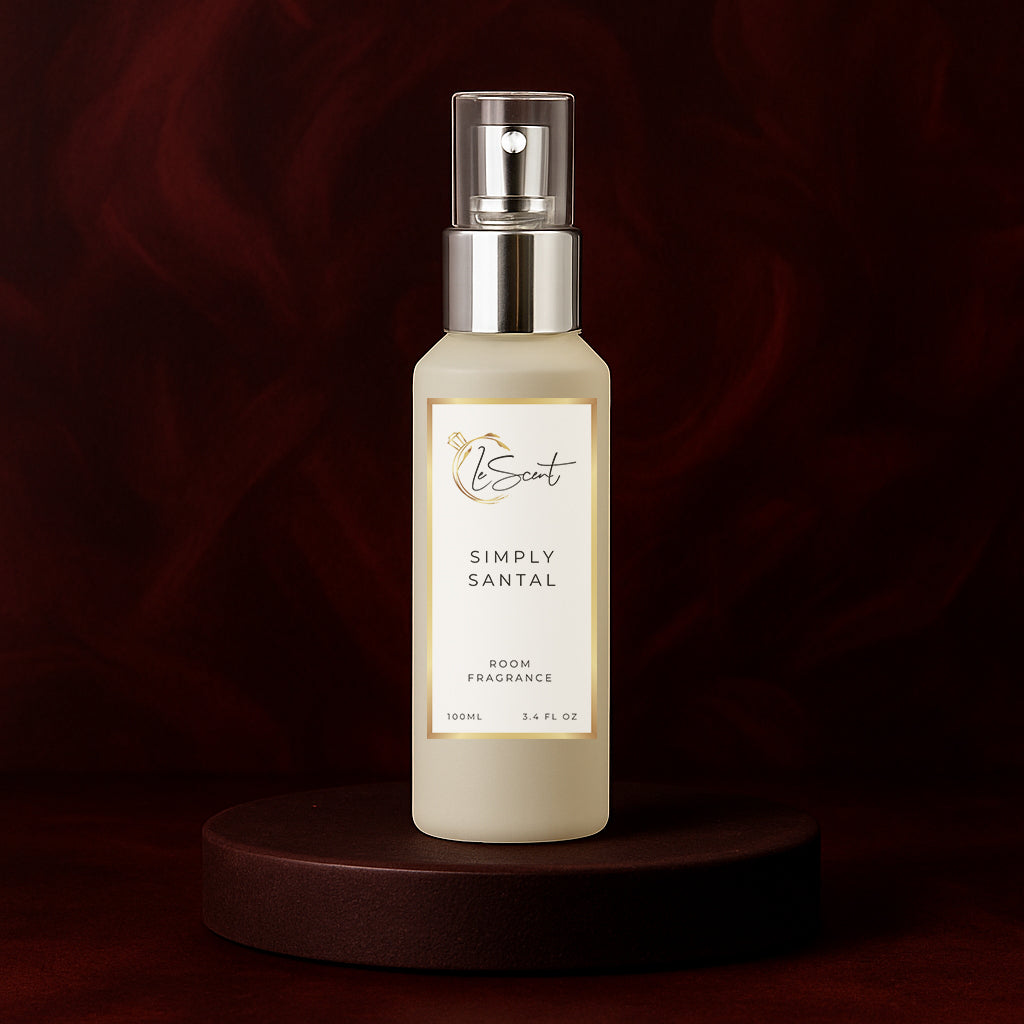 LeScent Simply Santal room fragrance spray bottle placed on a dark burgundy pedestal with warm spotlight and velvety background, inspired by Le Labo Santal 33.