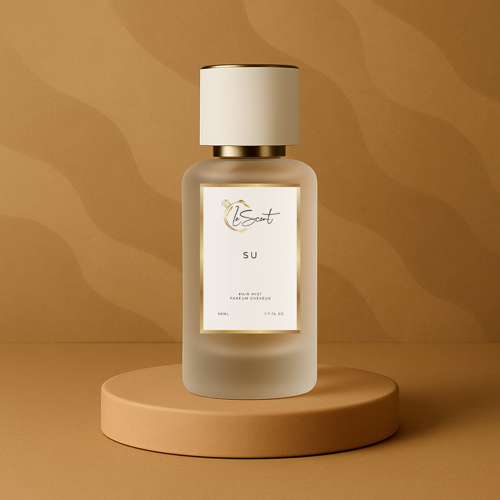 LeScent SU hair fragrance mist bottle placed on a warm beige pedestal with a smooth tan background and soft gradients, inspired by Kayali Vanilla 28.